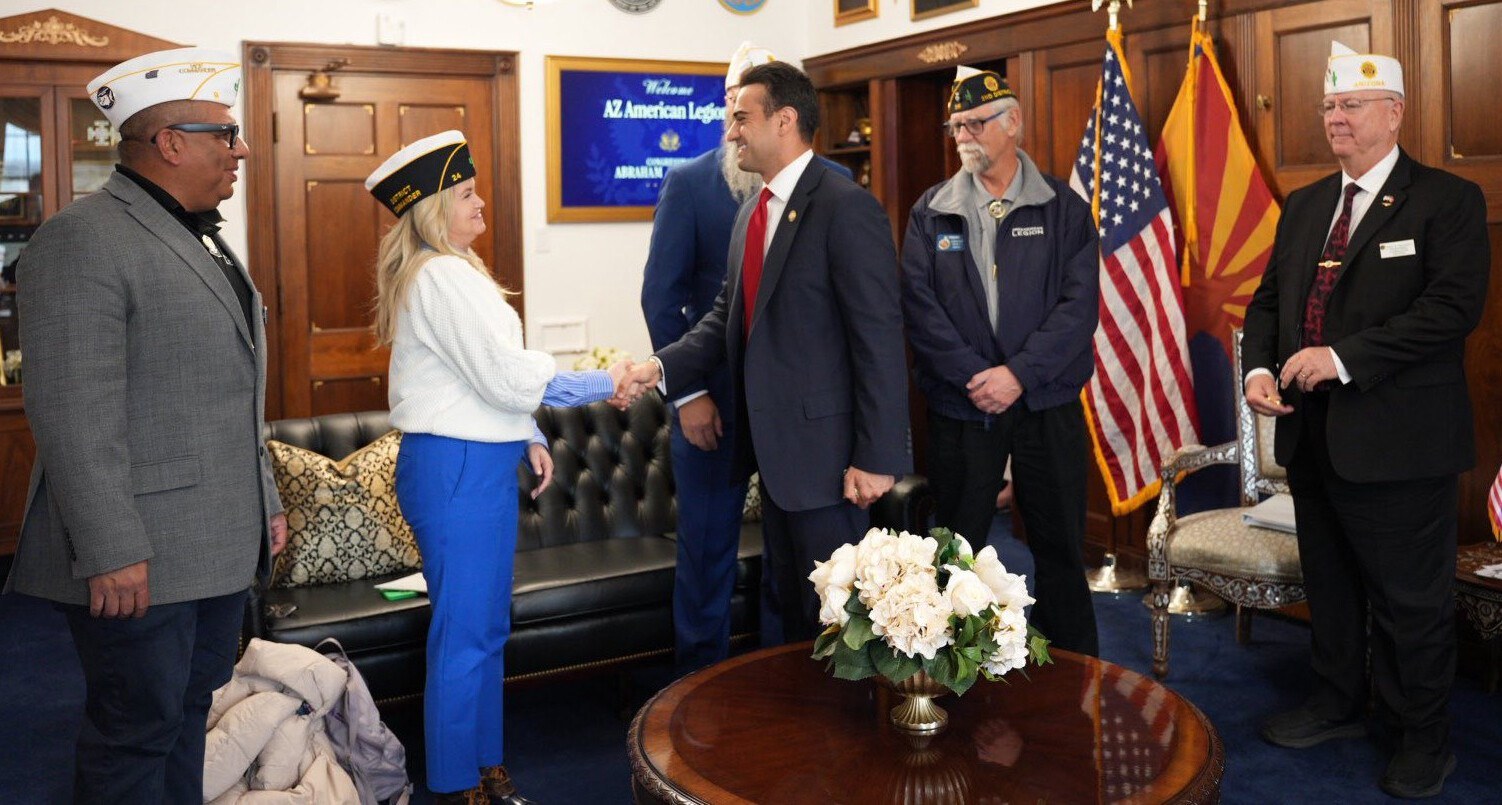 American Legion members greeting one another at a formal gathering
